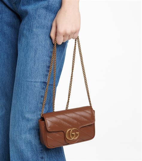 Gucci GG Emblem super mini shoulder bag .